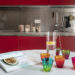 an elegant apartment in Veneto, with a kitchen in red and contrasting styles