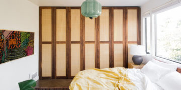 a master bedroom with en-suite bathroom and nature views