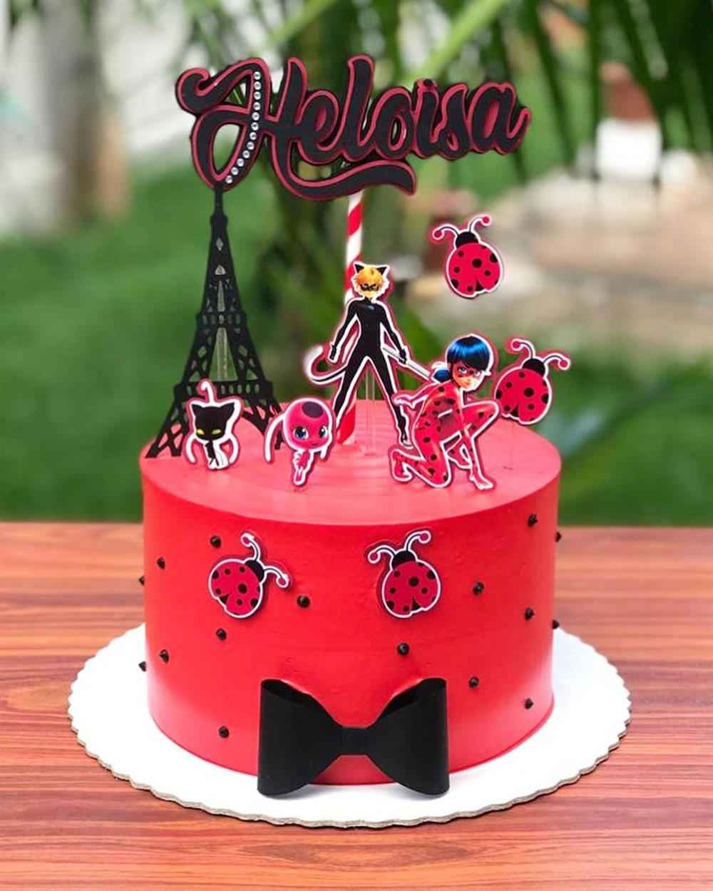 simple cake with ladybug cake topper