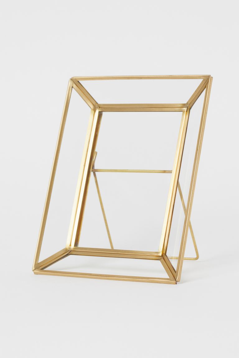 Frame in glass and metal