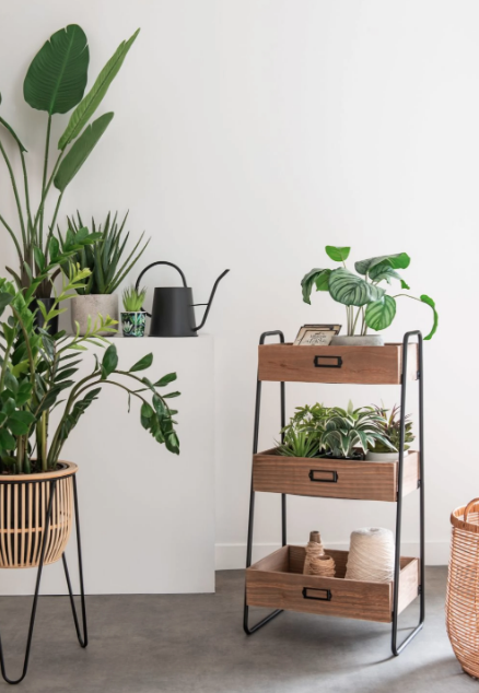 Small storage cabinet with 3 black metal boxes