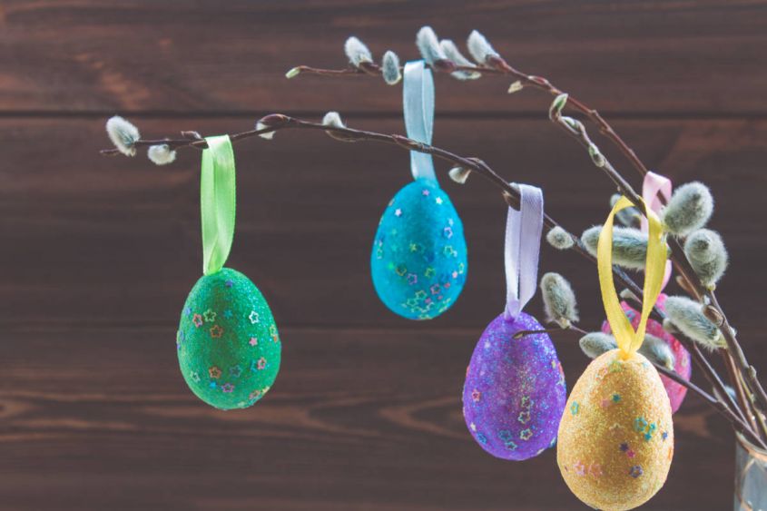 easter tree with willow branches and colorful glitter eggs