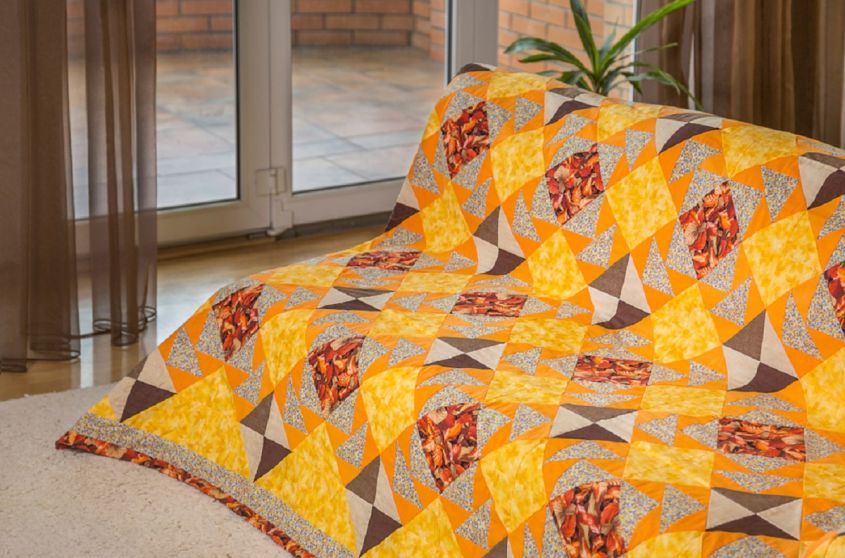 yellow patchwork style sofa cover