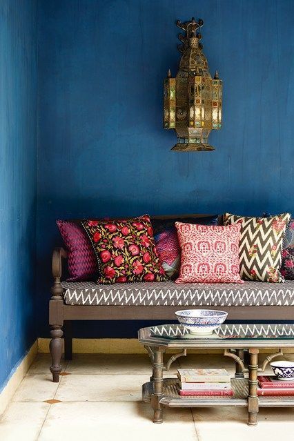 Living room in Indian style with blue wall