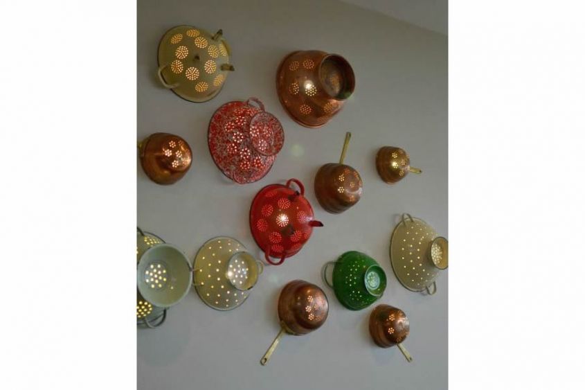 Plates and colander on the wall