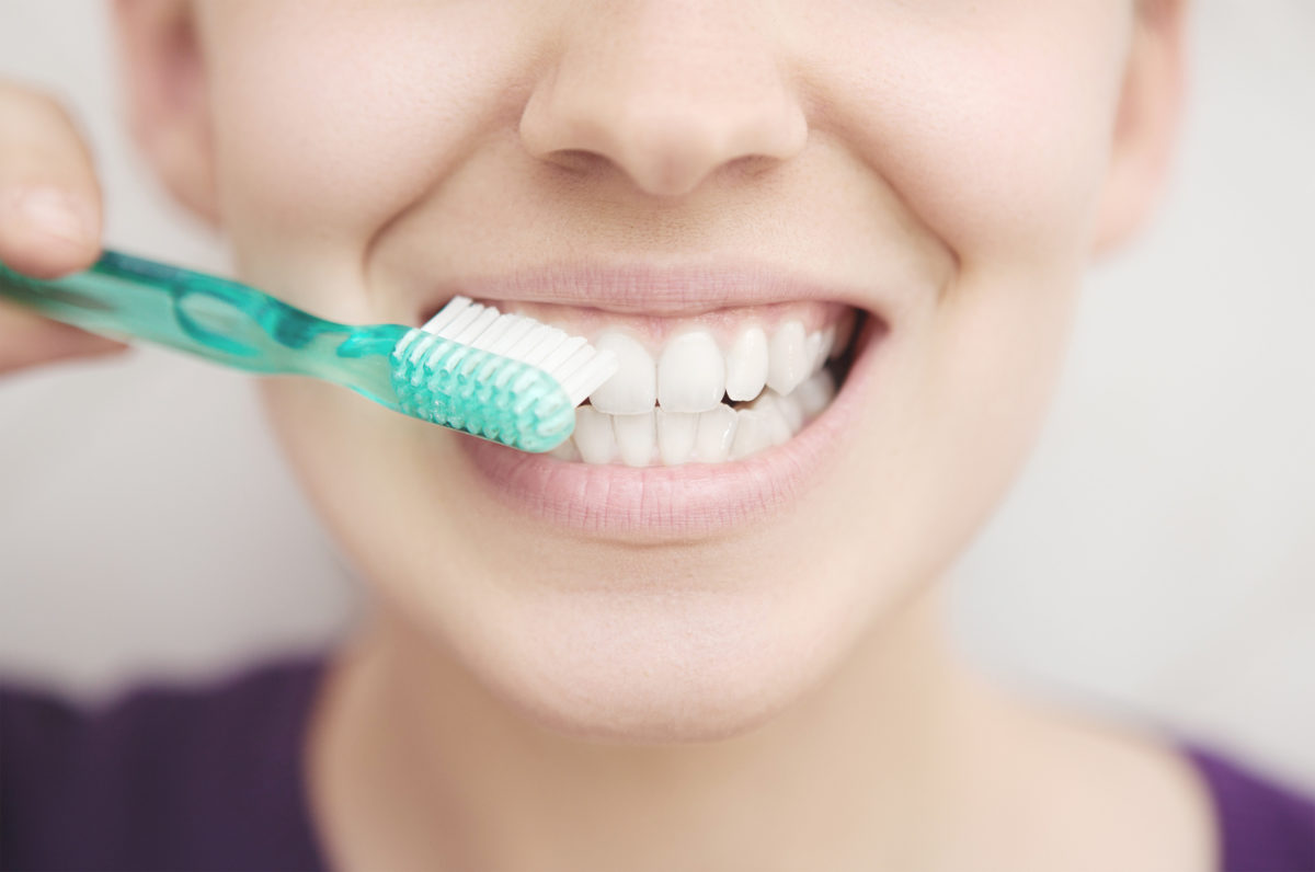 Woman with toothbrush