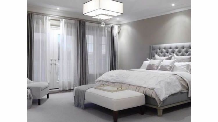 Gray curtains and bed