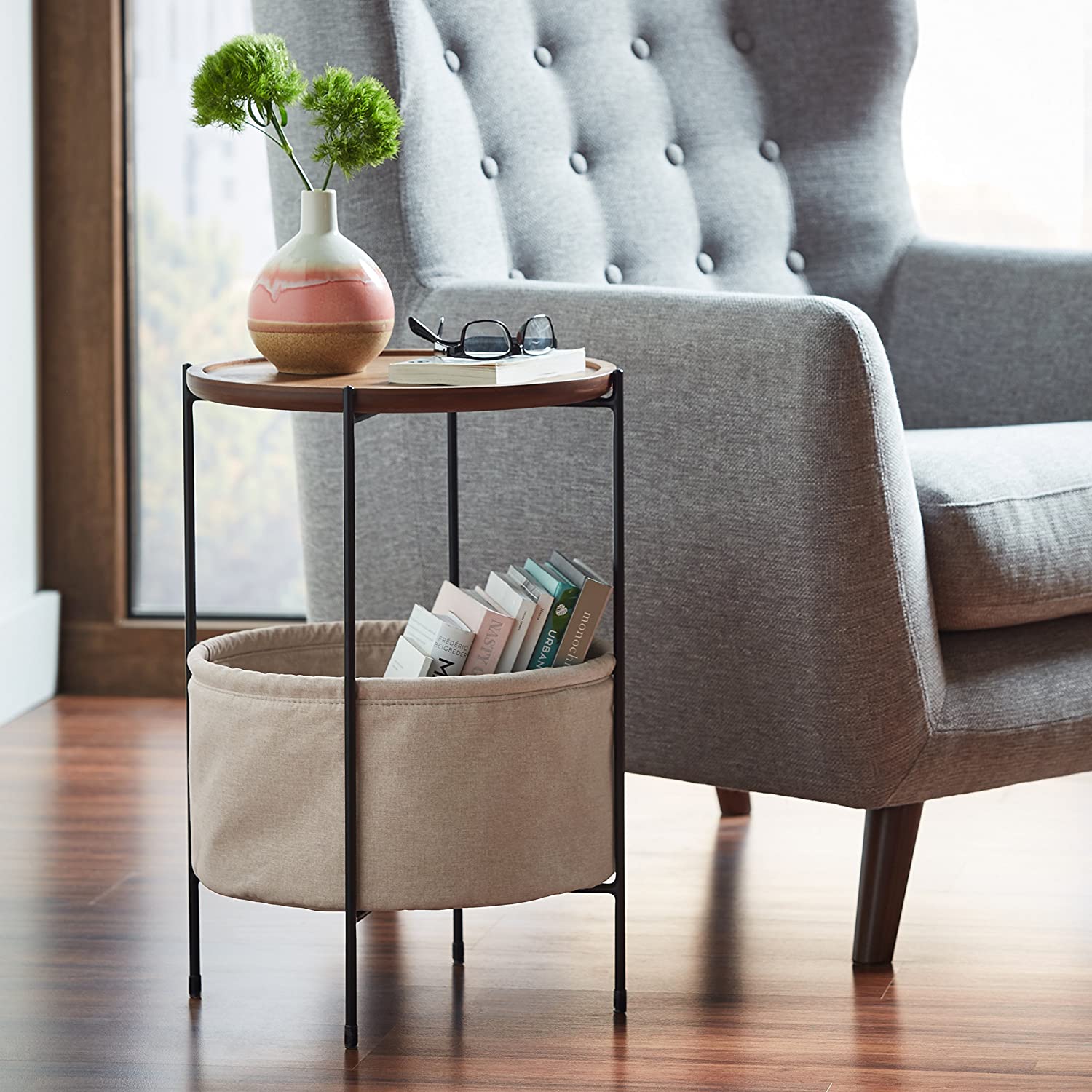 Rivet side table in wood, metal and fabric.