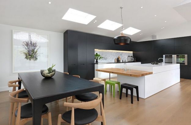 Black and white kitchen with light wood details