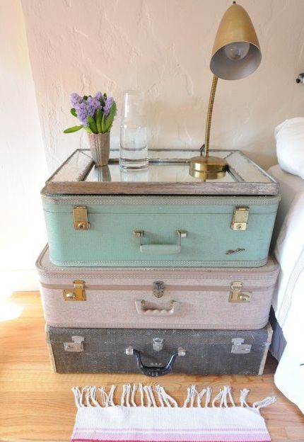 bedside table. suitcases