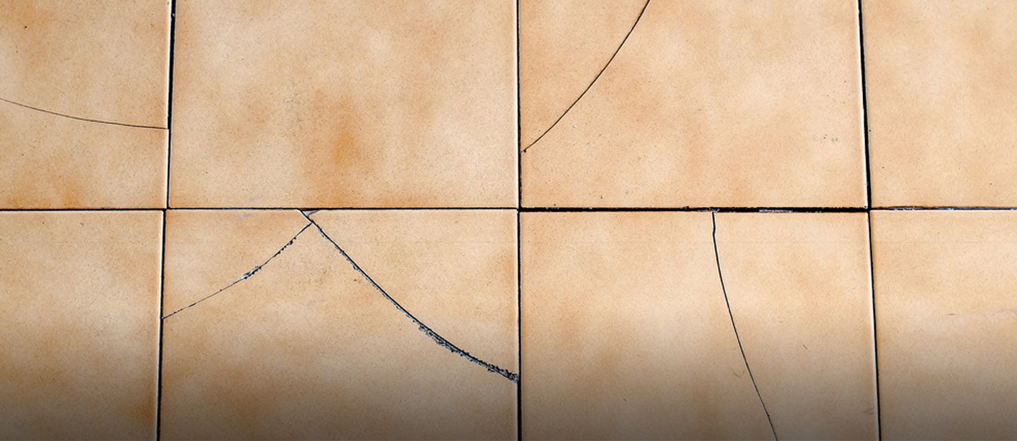 How do you fix cracked tiles without replacing them?