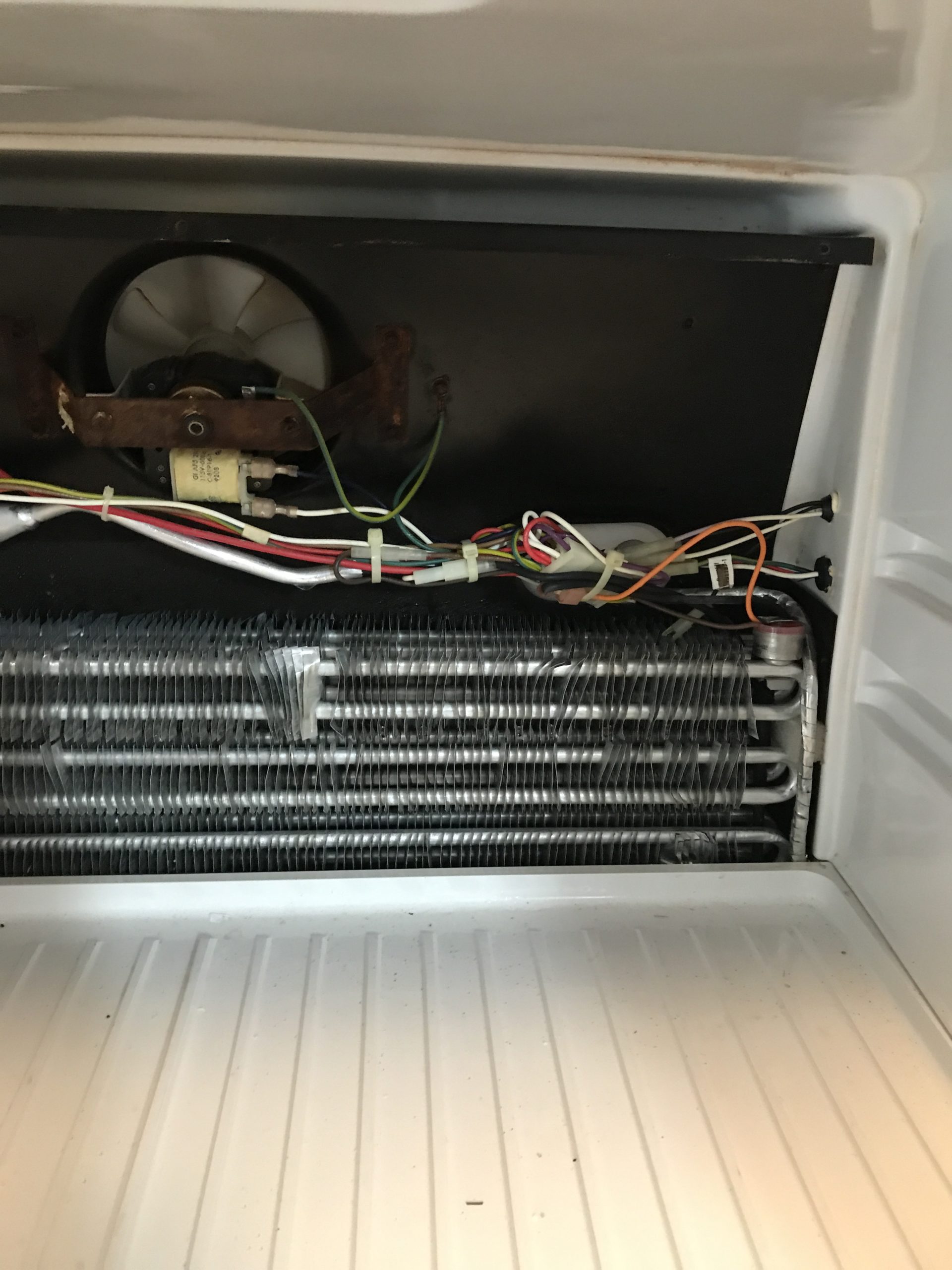 Where is the defrost drain in my freezer?