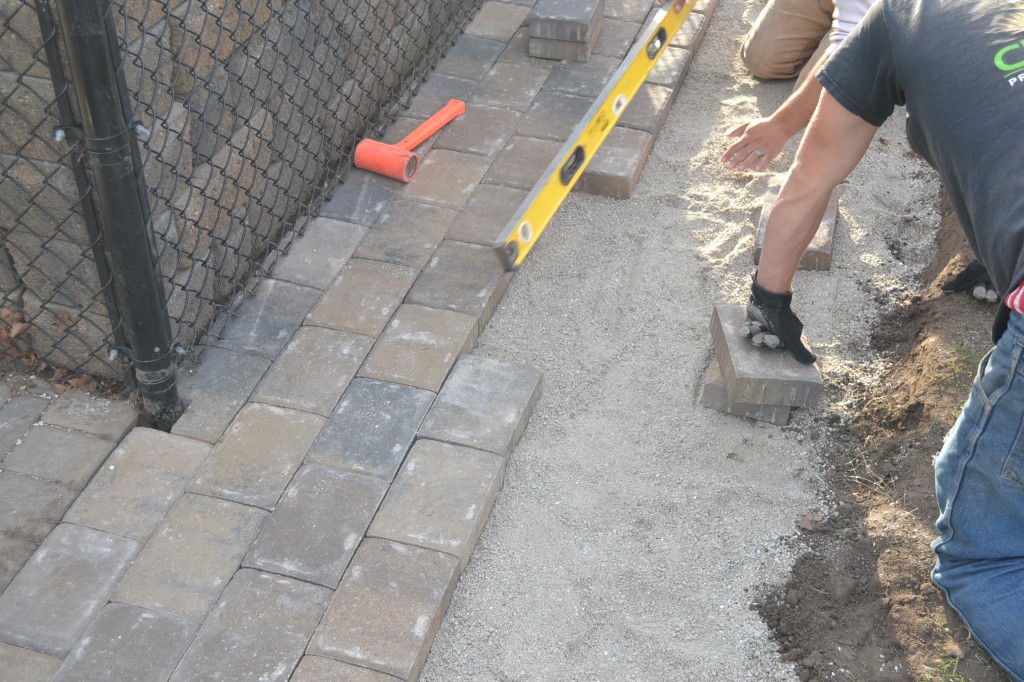 Can you lay pavers over dirt?