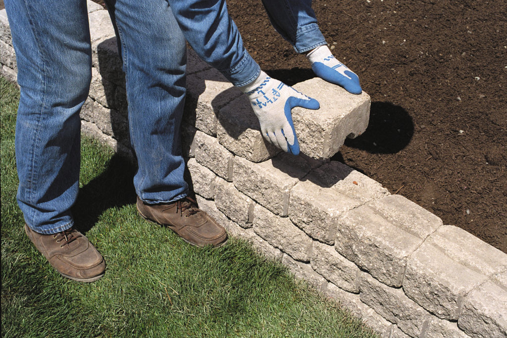 build-a-block-retaining-wall-to-beautify-a-steep-slope-garden