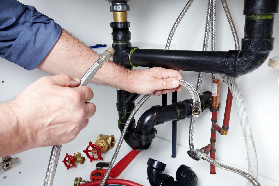 When should you call a plumber for a clogged drain?