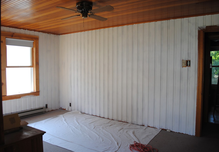 How do you cover wood paneling in a mobile home?