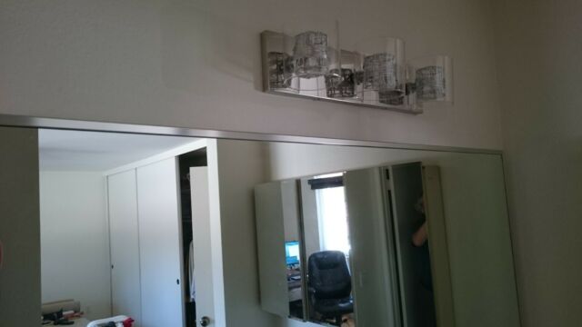 How do you hang a mirror on a masonry wall?