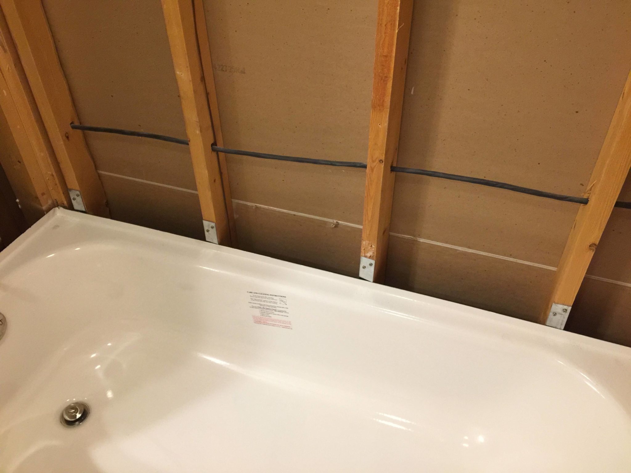 What is the best material to use behind shower walls? Interior